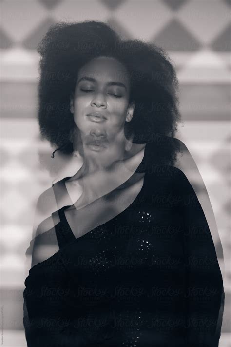 "Black And White Portrait Of A Young African Woman Through The Glass