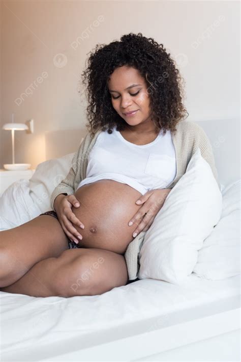 African Pregnant Woman Touching Her 39 Weeks Belly Photo Background And