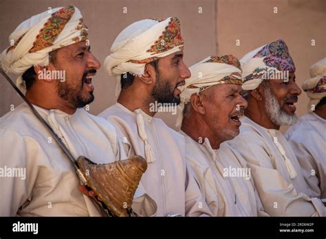 group  omani men dressed  traditional clothes perform  dance