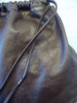 DECADES INC.: "Over the shoulder boulder holder"