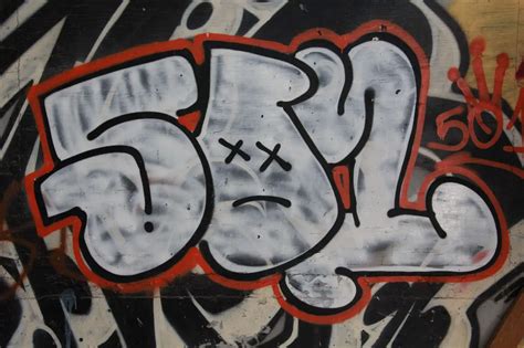Letter Spray Painted In White Red Graffiti On Wall - Texture X