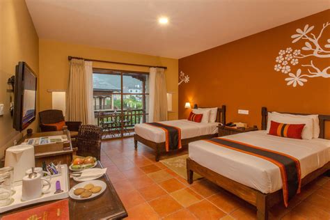 A typical hotel bedroom at Temple Tree Resort And Spa, Lake Side ...