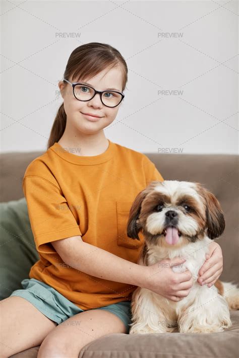 Girl With Down Syndrome Posing With Dog - Stock Photos | Motion Array