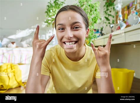 Teenage female student having video call, looking at webcam Stock Photo ...