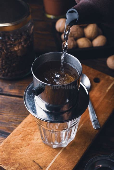 Pouring Hot Water into a Vietnam Coffee Filter Stock Photo - Image of ...