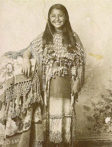 An indigenous girl named O-O-dee smiling, who was part of the Kiowa