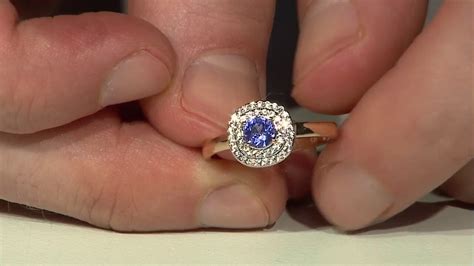 Schicker 0,36ct Tansanit 18K Gold Ring, Zirkon Halo