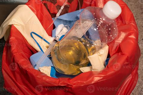 Urine bottle in red garbage 11694514 Stock Photo at Vecteezy