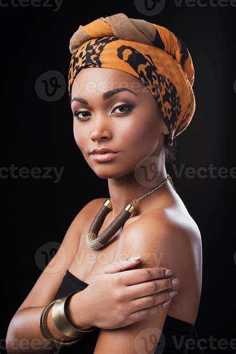 True African beauty. Beautiful African woman wearing a headscarf and
