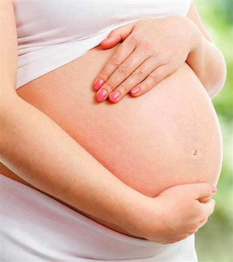 Download Holding Pregnant Belly Wallpaper | Wallpapers.com