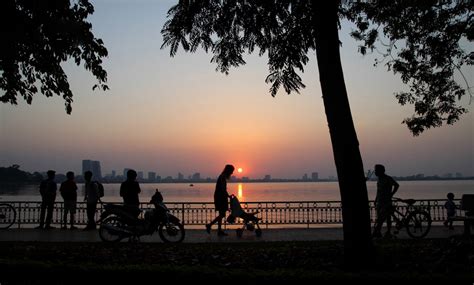 sunset  ho tay west lake hanoi  living nomads travel tips