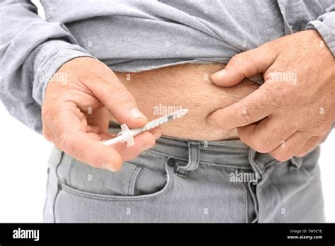 Diabetic patient injecting insulin in stomach, closeup Stock Photo - Alamy