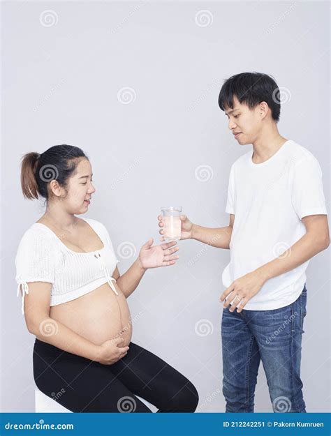 Portrait of a Happy Pregnant Wife with Her Husband Stock Image - Image