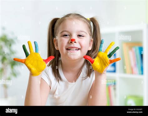 cute kid child showing her hands painted in bright colors Stock Photo ...