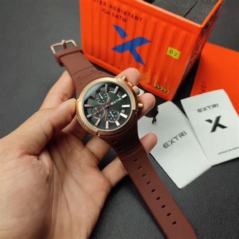 jual jam tangan extri  fullset box kontainer sebatang pohon