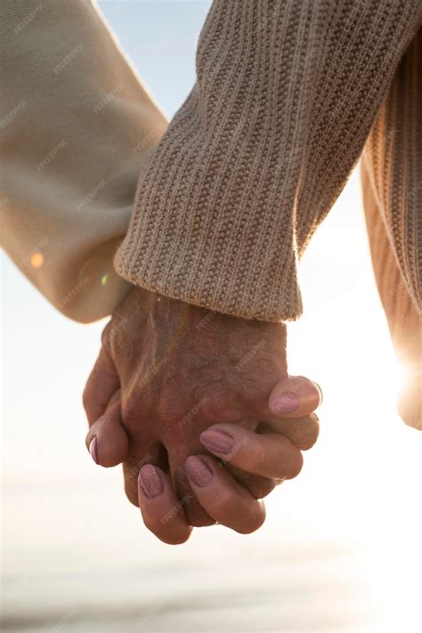 Premium Photo | Close up old couple holding hands