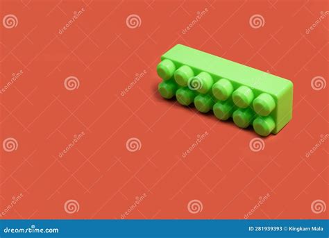 green building block  orange background stock image image  cube