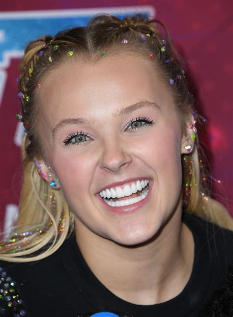 Jojo Siwa's Hair Is a Rainbow Eruption Doused In Holographic Hair