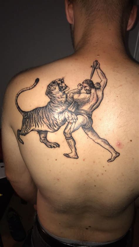 My first tattoo based on an old engraving of a gladiator fighting a tiger. To commemorate my ...