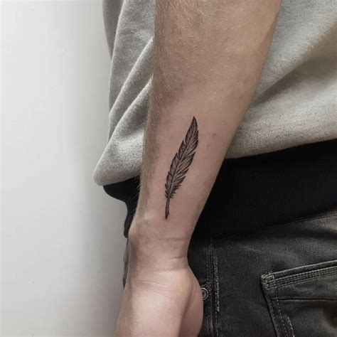 50 Beautiful Feather Tattoo Designs | TattooAdore | Wrist tattoos for ...