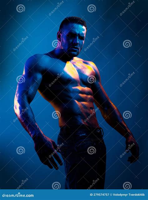 Topless Shirtless Male Model. Naked Bodybuilder on Blue Neon Light