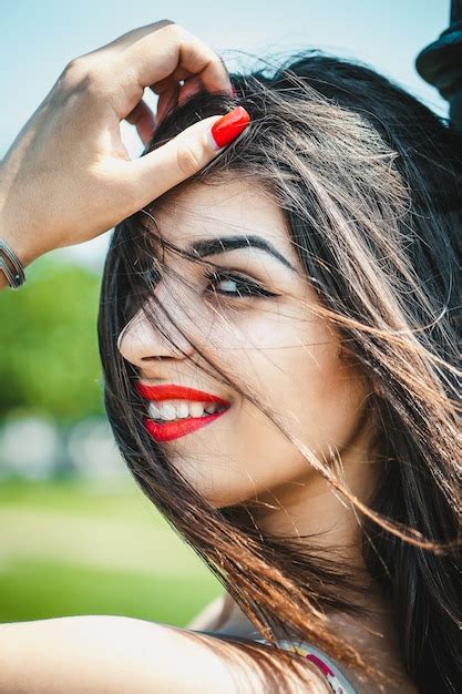 Premium Photo | Beautiful young woman feeling happy and full of life.