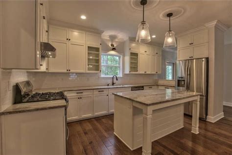 Open Kitchen with Granite Island and Alabaster Cabinets