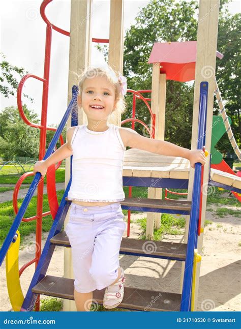 Happy Little Girl On Outdoor Playground Equipment Stock Photo - Image