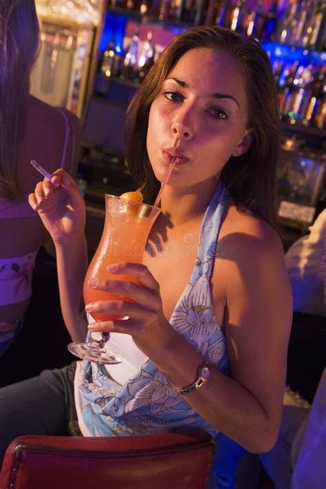 Young Woman Drinking And Smoking At A Bar Stock Image - Image of ...