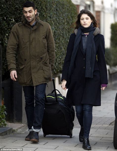 Gemma Arterton cuts a cheerful figure as she steps out with a mystery ...