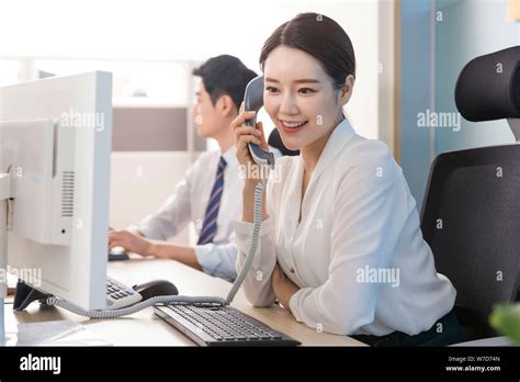 Office life concept, two asian business partners working in office 202 ...