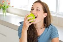 woman eating apple  stock photo public domain pictures