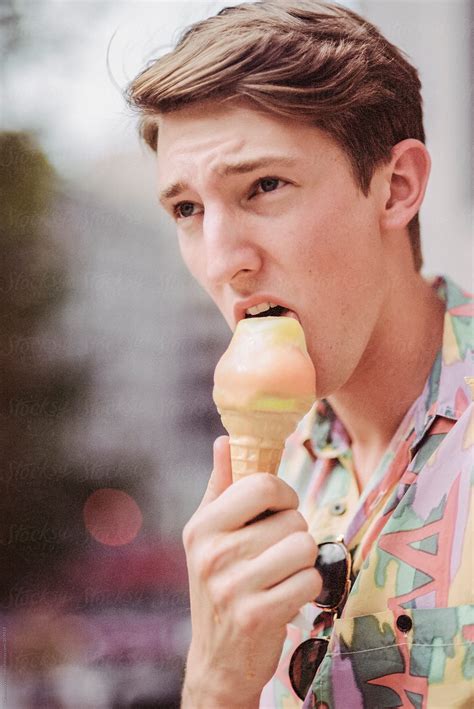 "Man Eating Ice Cream" by Stocksy Contributor "CWP, LLC" - Stocksy