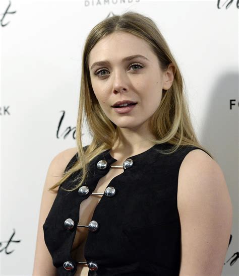 Elizabeth Olsen with her mouth open and her side boob - MyConfinedSpace