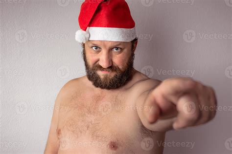 Bearded half-naked Santa Claus man 2600791 Stock Photo at Vecteezy