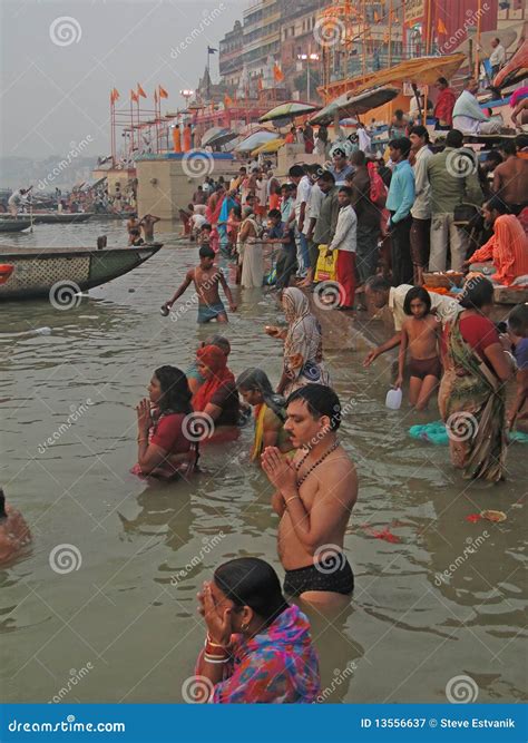 Hindus Perform Ritual Puja at Dawn in the Ganges Editorial Photography