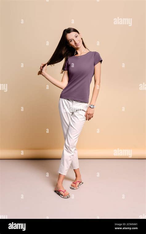 beautiful smiling young woman pulling  hair stock photo alamy