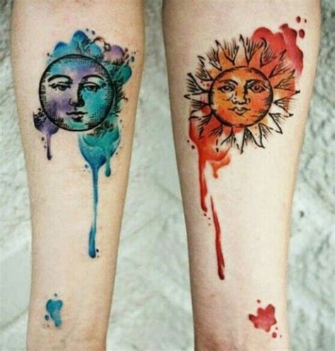 Picture Of Red sun and blue moon tattoos on the arms