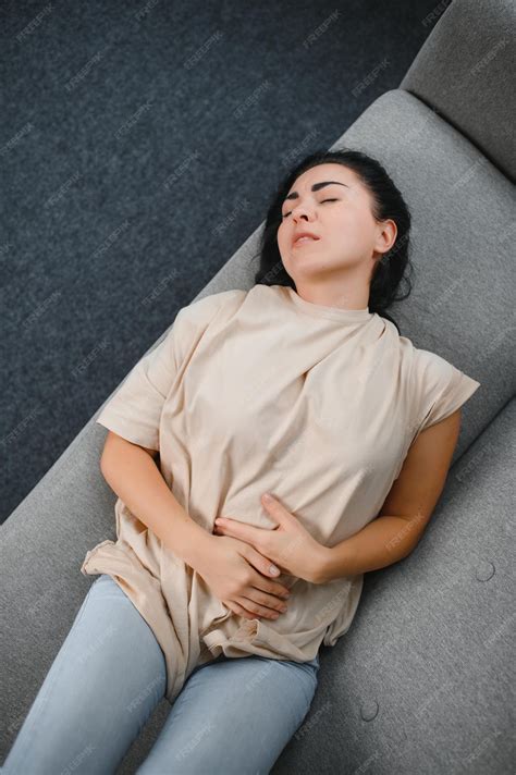 Premium Photo | Young beautiful hispanic woman in painful expression