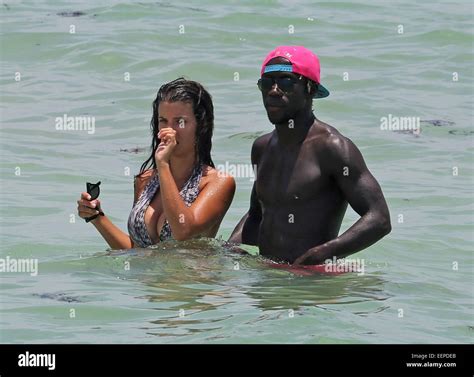 French football player Bacary Sagna and his wife Ludivine Kadri Sagna ...