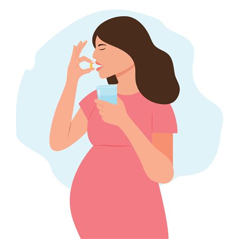 Pregnant woman takes a supplement or vitamin. Woman holds a pill in her
