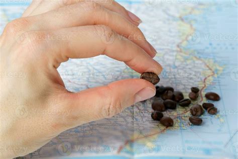 Coffee beans on a map. Closeup 24993856 Stock Photo at Vecteezy