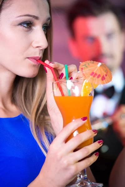 People drinking cocktails in luxury bar — Stock Photo © Kzenon #77908924