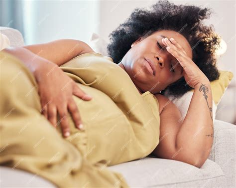 Premium Photo | Pregnant tired and black woman on sofa with headache