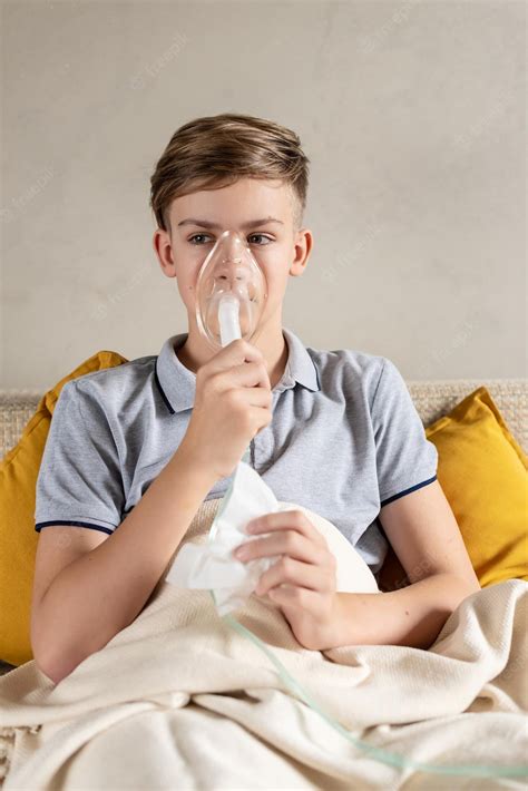 Premium Photo | Sick teen boy with an inhaler unhealthy child doing