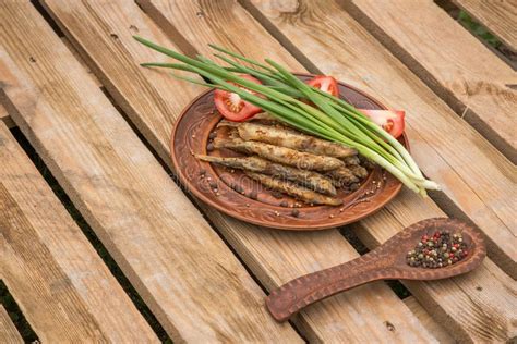 Fried Small Fish on the Wooden Background Stock Image - Image of ...