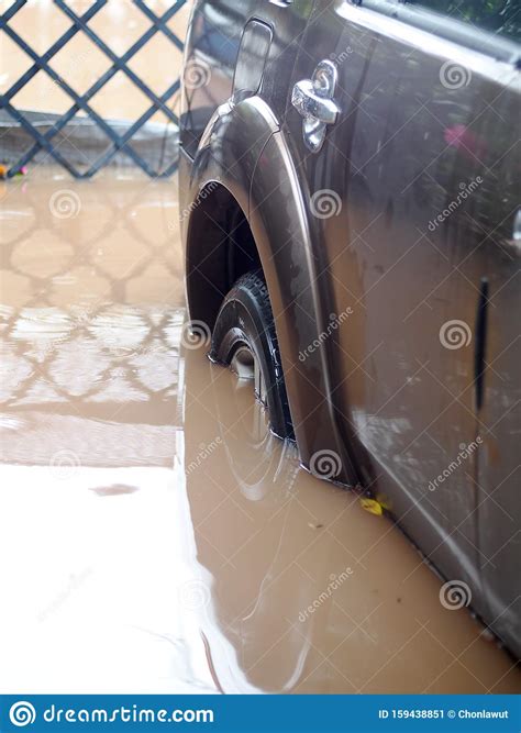 Dirty Muddy Dirt and Toxic Water Flood after Heavy Rain in Urban Zone