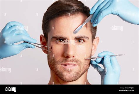 Man receiving aesthetic facial treatment Stock Photo - Alamy