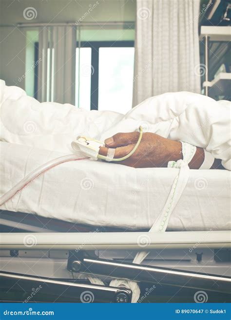 Patient`s Hand Tied To the Bed Stock Image - Image of people, person