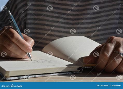 woman    hand writing   journal stock photo image